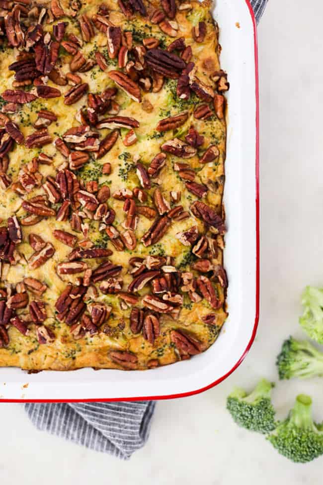 Whole30 broccoli casserole overhead shot with nut toppings - healthy casseroles