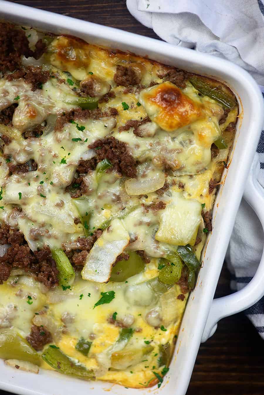Philly cheese steak casserole covered in melted cheese