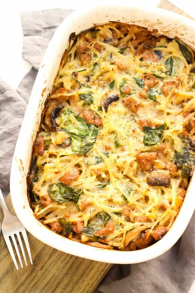 Creamy sausage and potato whole30 casserole overhead shot with fork - healthy casseroles