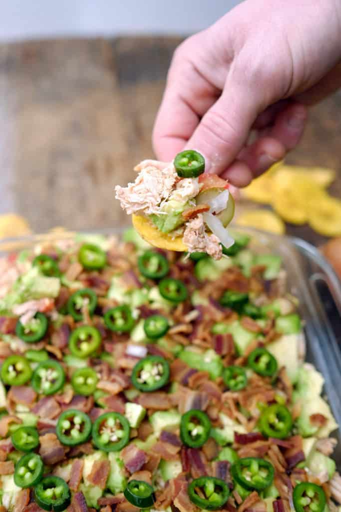 This Paleo + Whole30 seven layer dip cuts out the sour cream and cheese you’d find in a traditional seven layer dip but it still packs on the flavor. Paleo + Whole30. | realsimplegood.com
