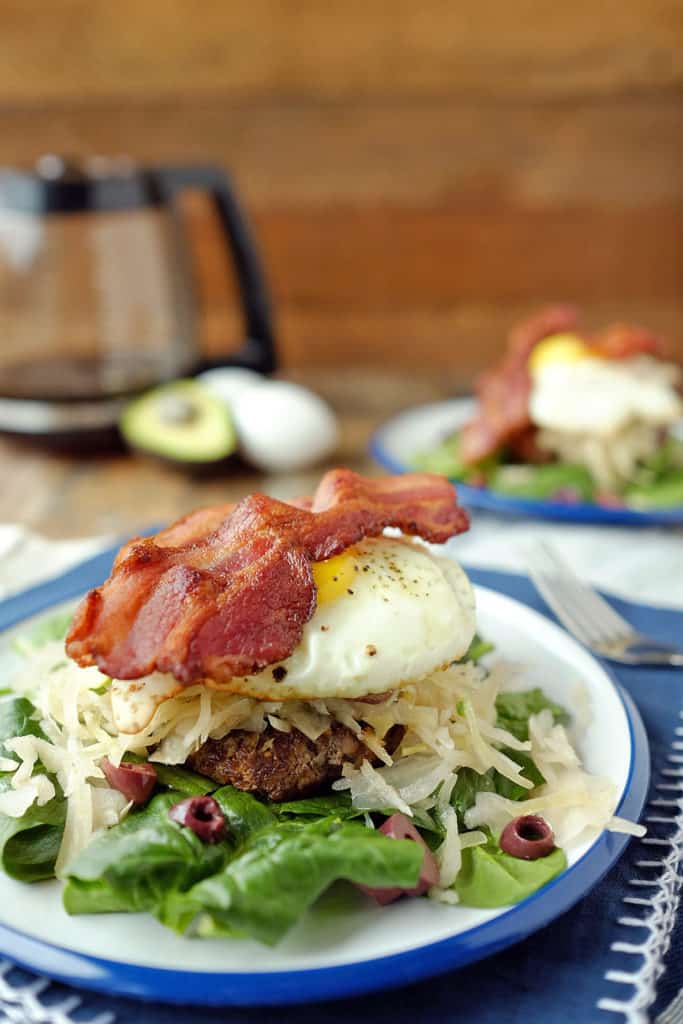 While the burger forms the base of this meal, the star of the show is really the stack of toppings piled on top of this Whole30 + paleo breakfast burger. Paleo + Whole30. | realsimplegood.com