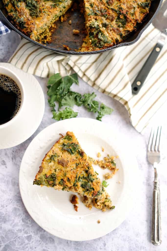 This Paleo + Whole30 sweet potato quiche has only six main ingredients is EASY to make. The eggs, sausage, kale, and sweet potaotes combine to make the perfect quiche. Paleo, Whole30, Dairy-Free, and Gluten-Free. | realsimplegood.com