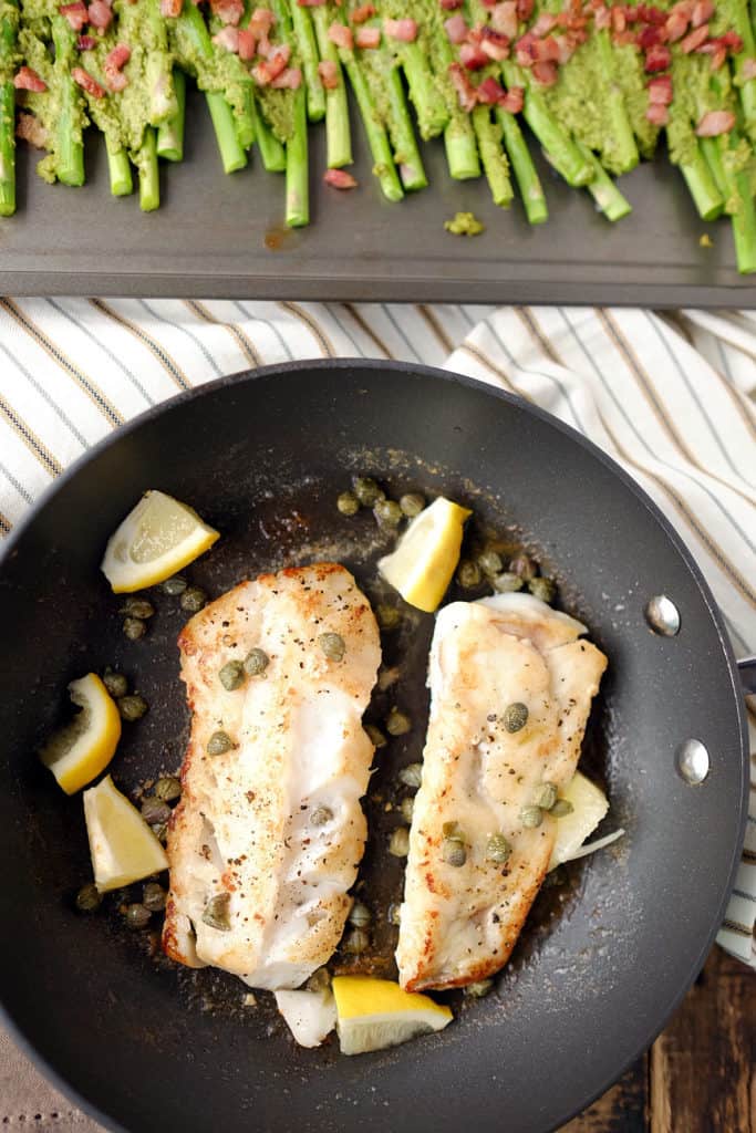 Need a speedy weeknight meal that feels like you put in more time and effort? This Paleo + Whole30 pan fried cod with pesto bacon asparagus is exactly that! Paleo + Whole30. | realsimplegood.com