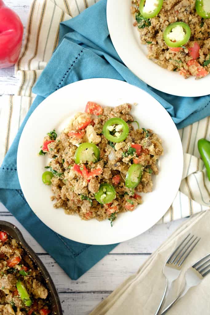 This Paleo + Whole30 version of dirty cauliflower rice is spicy, rich, filling and incredibly tasty. It's not a side dish, it's a whole meal! Italian sausage, jalapeno, bell peppers kale and mushrooms. Paleo + Whole30. | realsimplegood.com