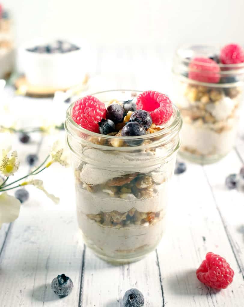 These berry granola parfaits are light and fluffy with a no-bake paleo granola and fresh berries. An easy snack to enjoy! Paleo, Gluten-Free, Dairy-Free and Refined Sugar-Free. | realsimplegood.com