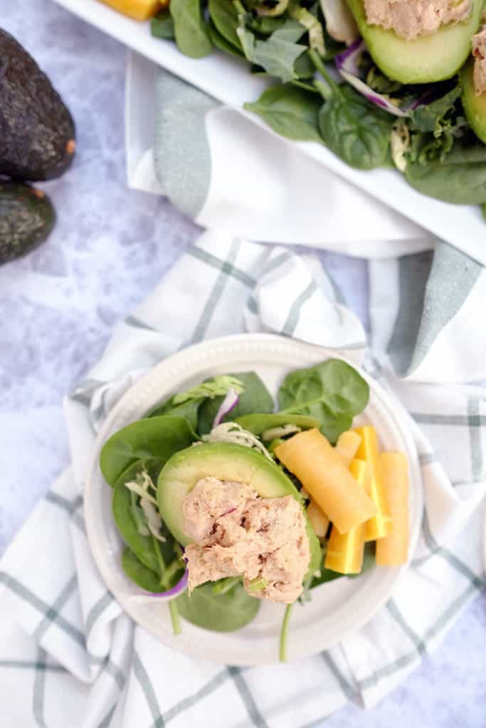 Do you struggle with lunch ideas, or are you looking for ways to up your lunch game? Here's a fresh Paleo + Whole30 idea - chicken salad stuffed avocados. Paleo, Whlole30 + Dairy-Free. | realsimplegood.com