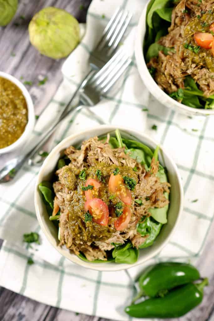 Tomatillos and chilies, garlic and cilantro blend to make the perfect sauce for tender pork in this easy Paleo + Whole30 crockpot pork chile verde recipe. Paleo + Whole30 | realsimplegood.com
