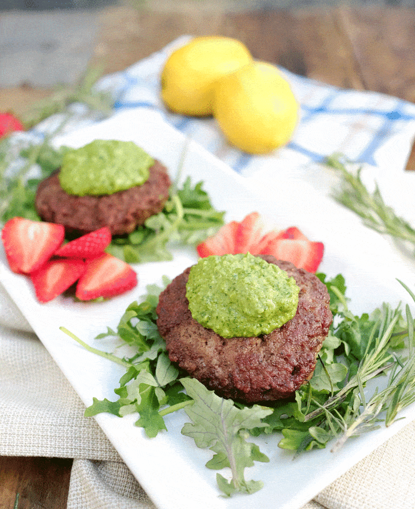 Rich and flavorful, these lamb burgers with rosemary pesto sauce are a gourmet meal that can be on your plate in under 20 minutes. Paleo + Whole30 friendly. Paleo, Whole30, Gluten-Free and Dairy-Free. | realsimplegood.com