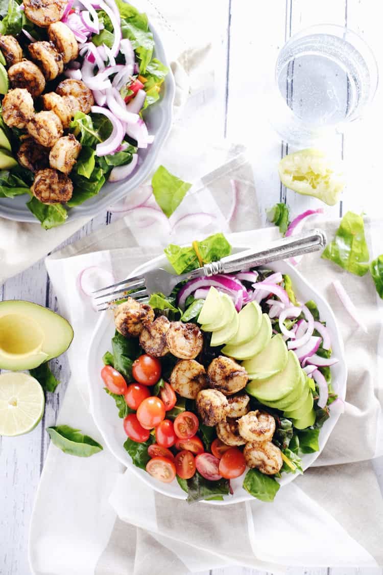 This cajun shrimp salad is an easy and fresh salad option. Make the Paleo + Whole30 salad packed with shrimp, avocado, tomato and onion! Paleo, Whole30, Gluten-Free + Dairy-Free. | realsimplegood.com