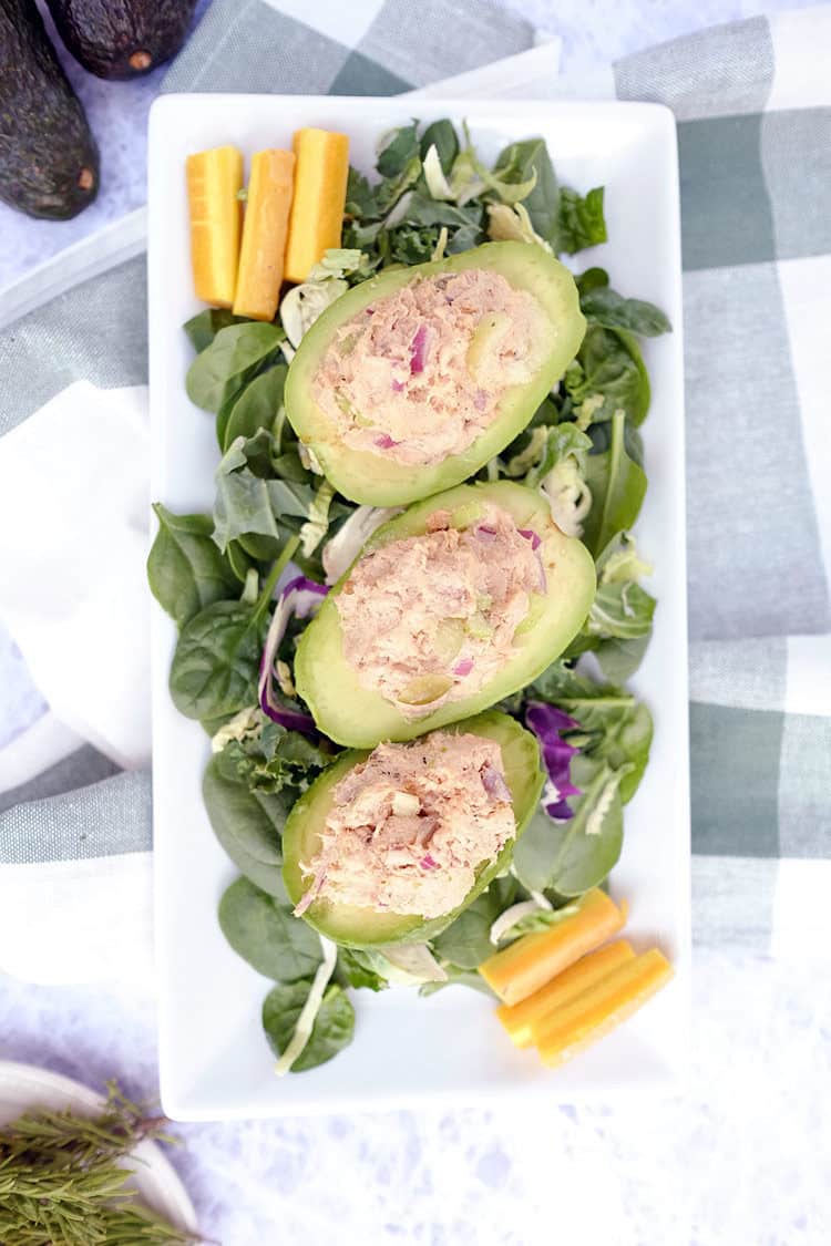 Do you struggle with lunch ideas, or are you looking for ways to up your lunch game? Here's a fresh Paleo + Whole30 idea - chicken salad stuffed avocados. Paleo, Whlole30 + Dairy-Free. | realsimplegood.com