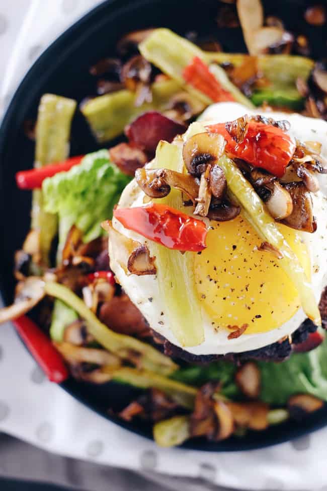 These chipotle bison burgers are an easy Paleo + Whole30 alternative to regular hamburgers. Topped with bacon, egg, peppers and mushrooms for amazing flavor! Paleo, Whole30, Gluten-Free + Dairy-Free | realsimplegood.com