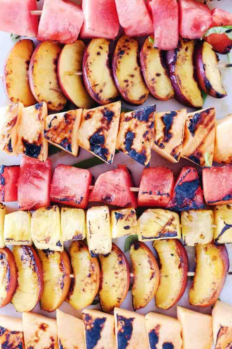 Have you tried grilling fruit yet? It is so delicious! Bring this Paleo + Whole30 grilled fruit salad to your next gathering to make you look like a pro! Grilled watermelon, peaches, cantaloupe and pineapple drizzled with balsamic and topped with basil. Paleo, Whole30, Gluten-Free + Refined Sugar-Free.| realsimplegood.com