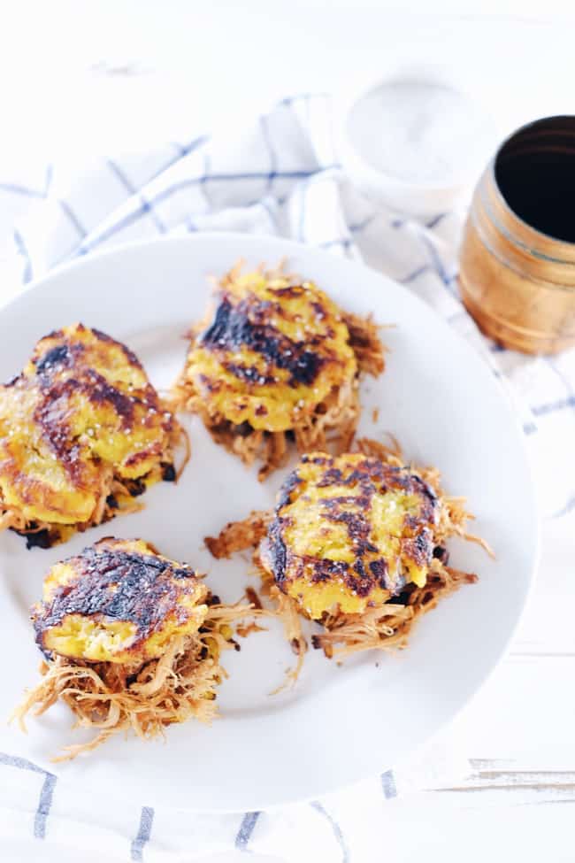These Paleo + Whole30 plantain pulled pork sliders are so much fun! Pulled pork piled high on top of a fried plantain bun is a treat that can't be beat. Paleo, Whole30, Gluten-Free + Whole 30. | realsimplegood.com