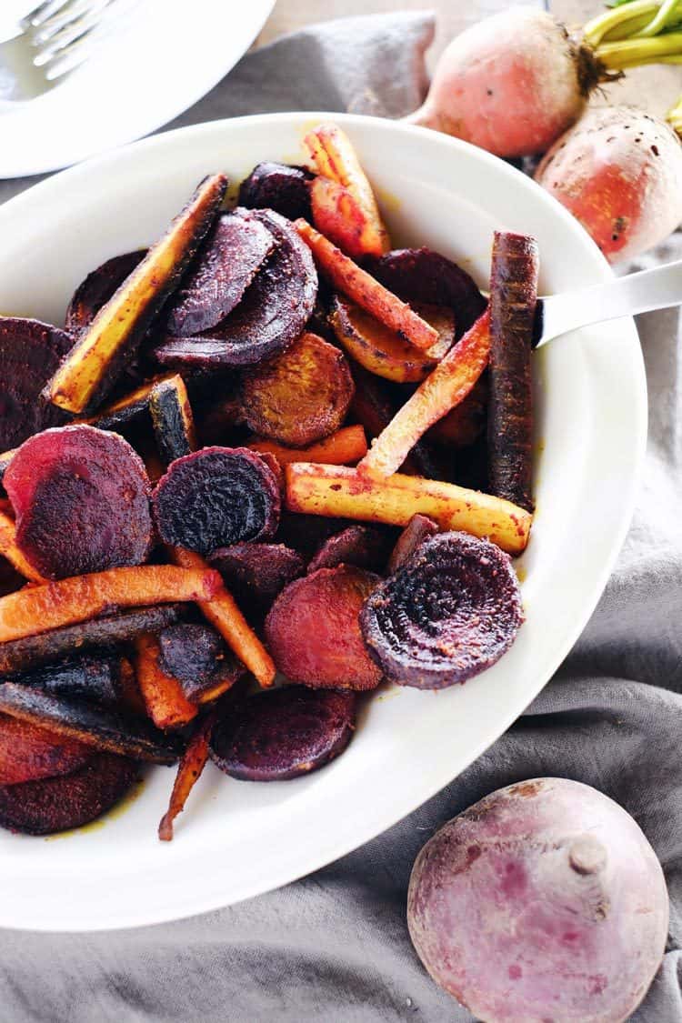 These turmeric maple roasted beets and carrots are an easy and delicious way to incorporate this powerful spice into your diet. Paleo + Gluten-Free | realsimplegood.com