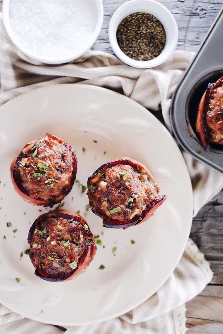 This mini bacon wrapped meatloaf recipe is a winner for many reasons! Paleo + Whole30, they are great for breakfast, lunch, or dinner! Did I mention bacon? Paleo, Whole30, Gluten-Free + Dairy-Free. | realsimplegood.com