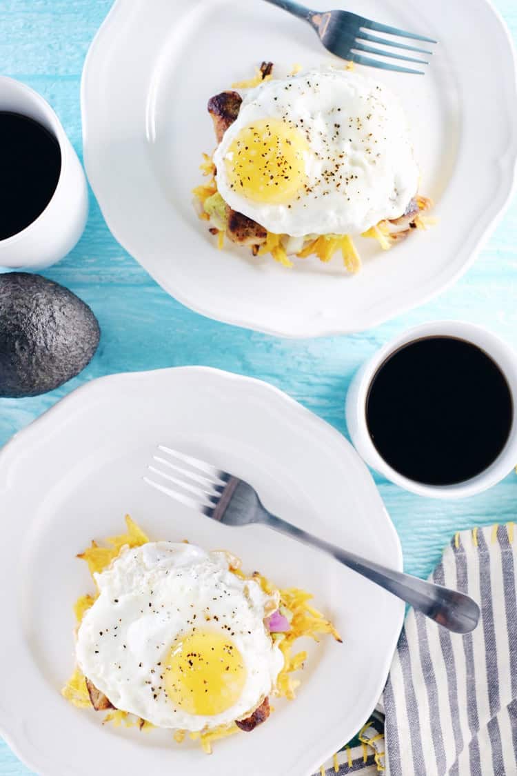 These paleo breakfast stacks are an easy to make favorite. A Whole30 breakfast with plantain hash browns, simple guacamole, sausage and eggs! Paleo, Whole30, Gluten-Free + Dairy-Free. | realsimplegood.com