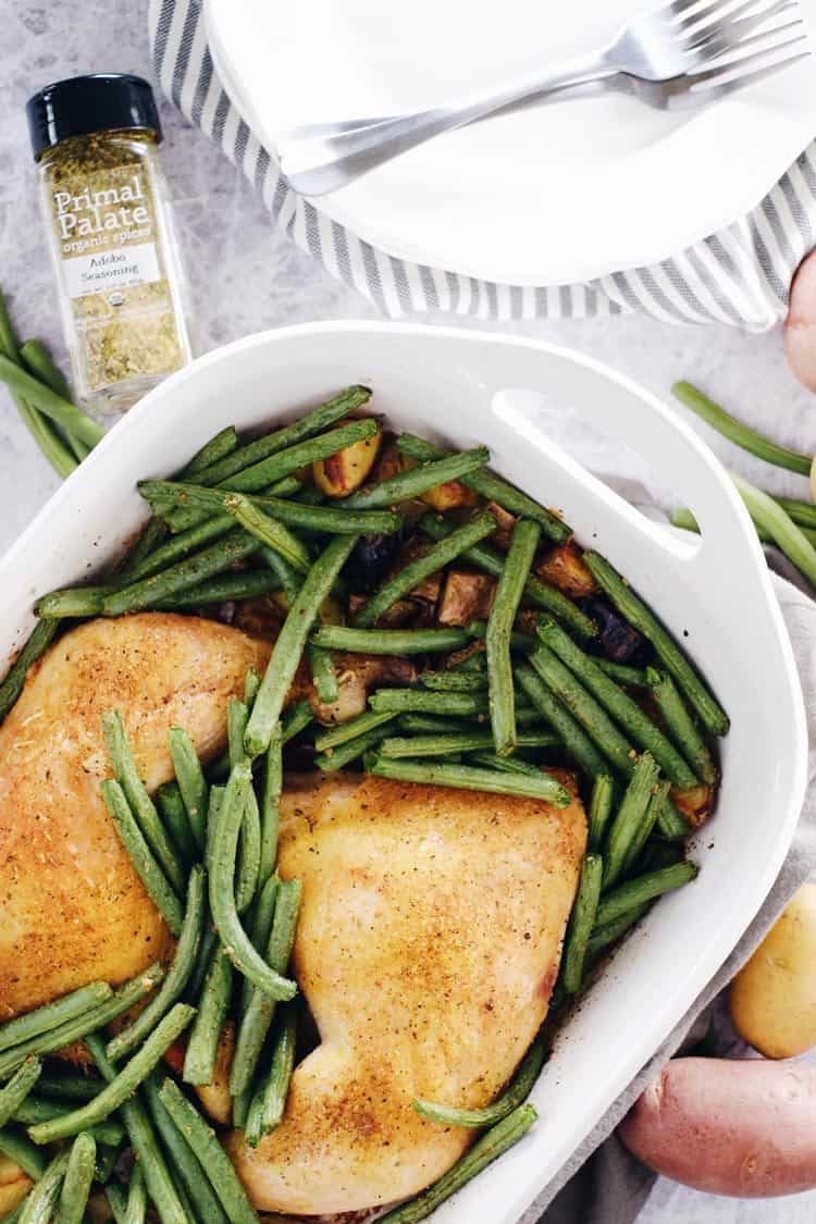 This one pan herb roasted chicken and veggies dish is so full of flavor from only 4 main ingredients! Paleo + Whole30, it's a breeze to make and clean up! Paleo, Whole30, Gluten-Free + Dairy-Free. | realsimplegood.com