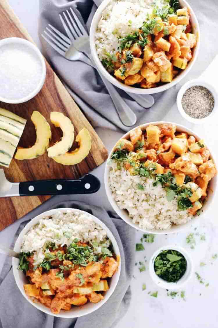 This Paleo + Whole30 red curry squash chicken bowl is so delicious, cozy and comforting. Quick and easy this fall favorite only takes 25 minutes to cook. Paleo, Whole30, Gluten-Free + Dairy-Free. | realsimplegood.com