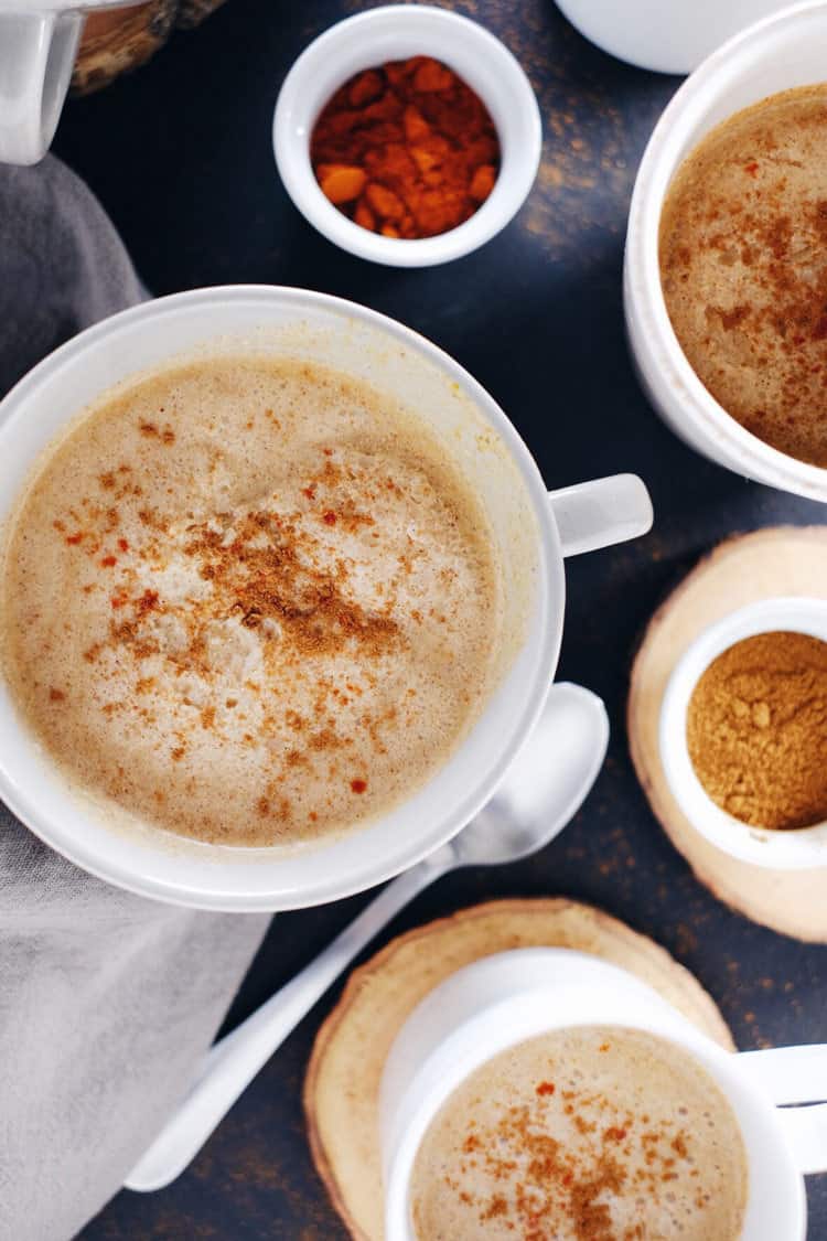 This spiced pumpkin coconut cider made with fresh pressed cider, coconut milk, cayenne, cinnamon and a couple other spices will keep you warm and cozy! Paleo, Gluten-Free, Dairy-Free + Refined Sugar-Free. | realsimplegood.com
