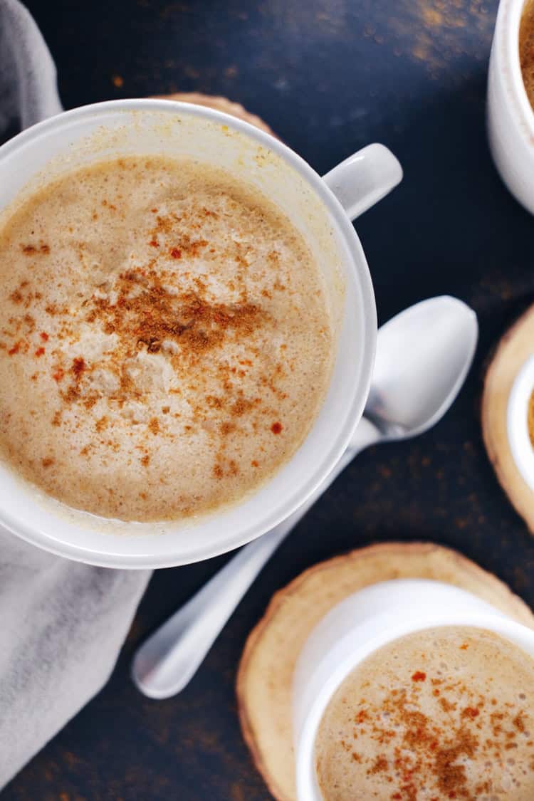 This spiced pumpkin coconut cider made with fresh pressed cider, coconut milk, cayenne, cinnamon and a couple other spices will keep you warm and cozy! Paleo, Gluten-Free, Dairy-Free + Refined Sugar-Free. | realsimplegood.com