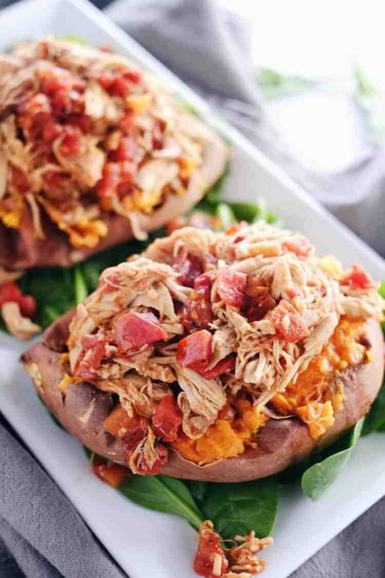 These crockpot maple chipotle chicken stuffed sweet potatoes are the perfect cold weather dinner. They're hearty, a little smoky and spicy-sweet. Paleo + Gluten-Free. | realsimplegood.com