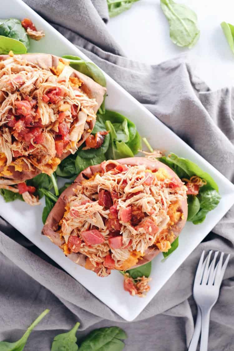 These crockpot maple chipotle chicken stuffed sweet potatoes are the perfect cold weather dinner. They're hearty, a little smoky and spicy-sweet. Paleo + Gluten-Free. | realsimplegood.com