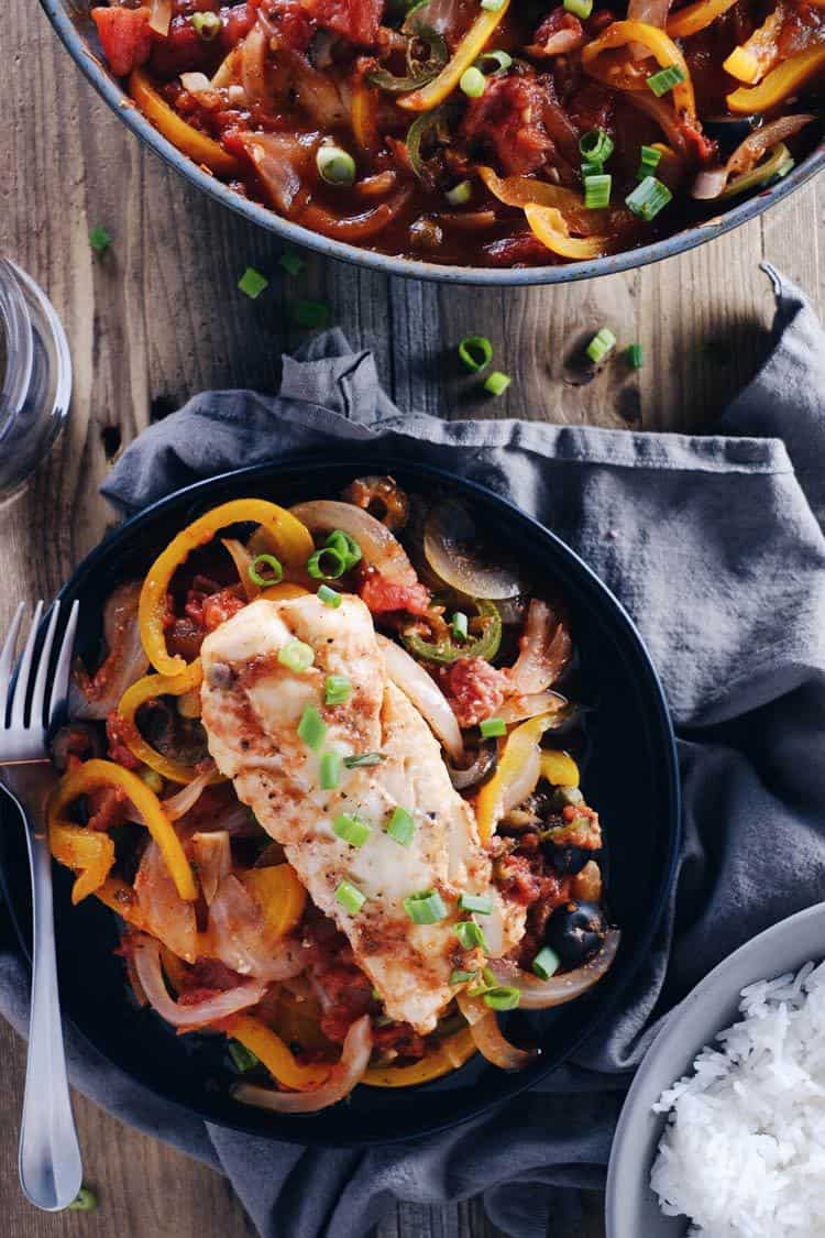 We love this veracruz style fish skillet because it is a refreshing Paleo + Whole30 way to enjoy fish! It's bursting with fresh veggies and flavors! Paleo, Whole30, Gluten-Free + Dairy-Free. | realsimplegood.com