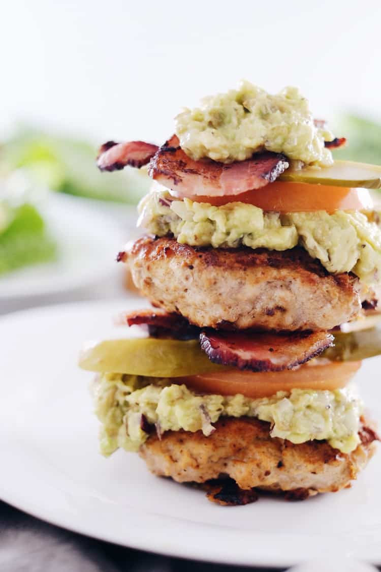 These chipotle turkey burgers are an easy way to enjoy Paleo + Whole30 burgers with smoky flavor, bacon and easy guacamole! Paleo, Whole30, Gluten-Free + Dairy-Free. | realsimplegood.com