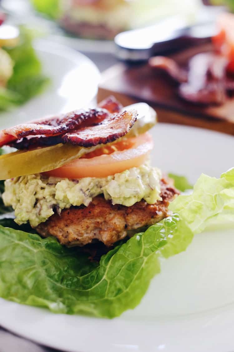 These chipotle turkey burgers are an easy way to enjoy Paleo + Whole30 burgers with smoky flavor, bacon and easy guacamole! Paleo, Whole30, Gluten-Free + Dairy-Free. | realsimplegood.com