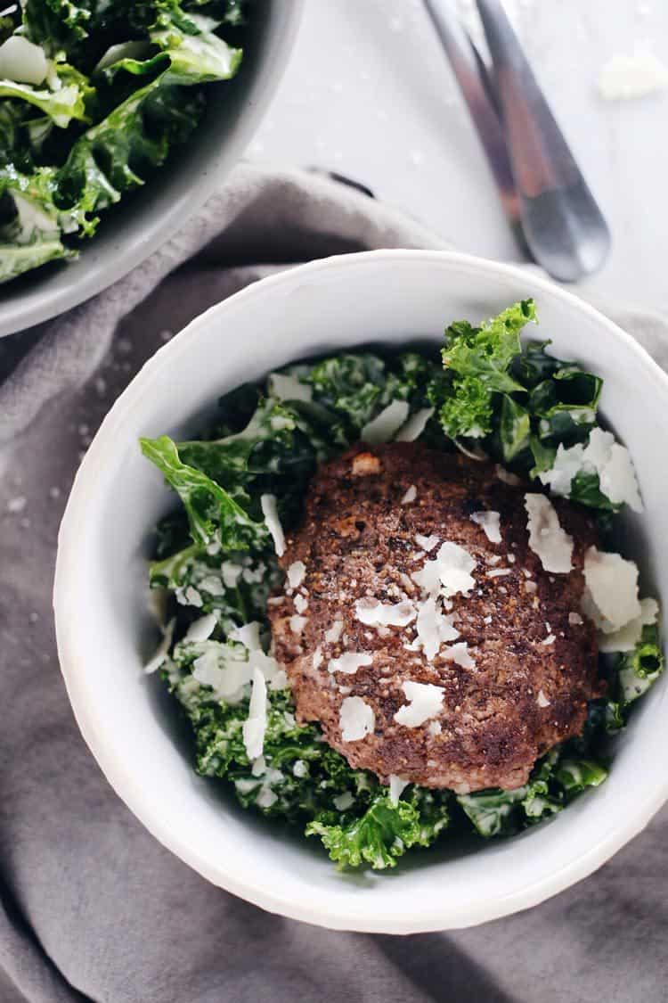 This kale caesar burger bowl is so satisfying with a Paleo + Whole30 caesar dressing and optional cheese topping. Quick, easy and great any meal of the day. Paleo, Whole30, Gluten-Free + Dairy-Optional. | realsimplegood.com