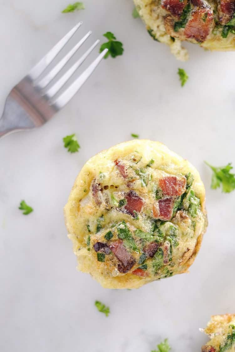 Don't slave in the morning to make a Paleo + Whole30 breakfast. Make these mushroom, spinach and bacon egg muffins ahead of time for easy weekday mornings! Paleo, Whole30, Gluten-Free + Dairy-Free. | realsimplegood.com