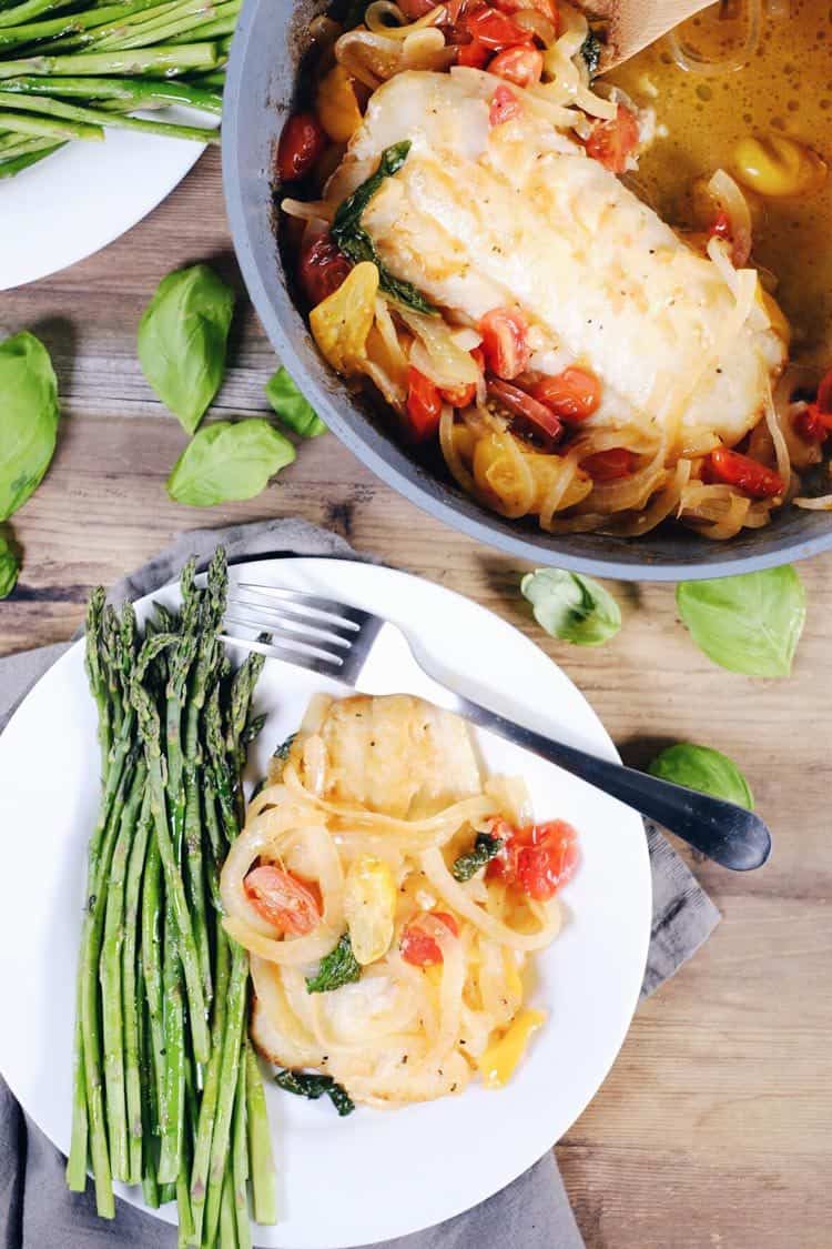 This tomato basil cod with asparagus is a quick and easy favorite! It feels fancy, but is really a simple and quick Paleo + Whole30 meal! Paleo, Whole30, Gluten-Free + Dairy-Optional. | realsimplegood.com