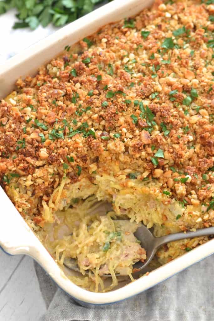 Jalapeno tuna casserole angle shot with scoop out and spoon in dish - healthy casseroles