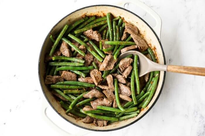 Cooked beef with garlic sauce in a pan