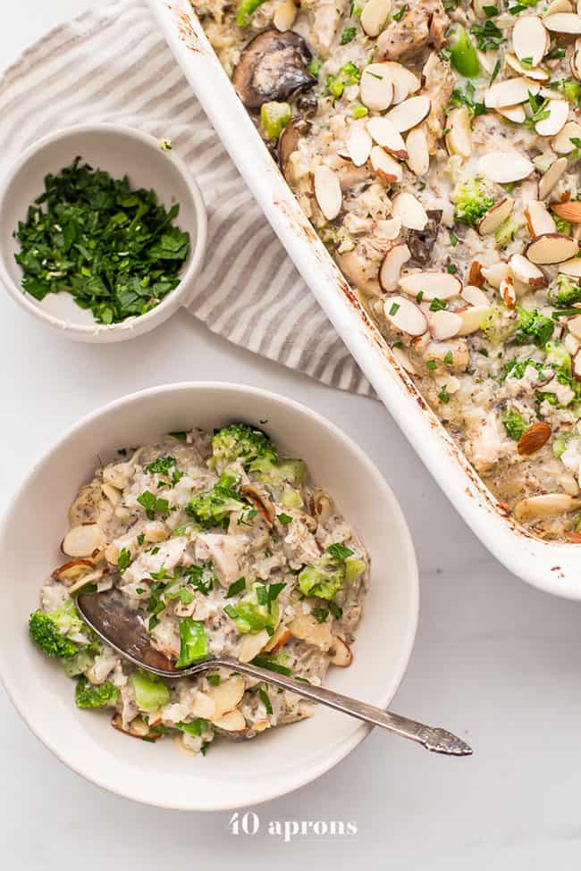 Whole30 casserole with chicken, broccoli, rice and mushrooms overhead shot with casserole dish and casserole in bowl with spoon - healthy casseroles