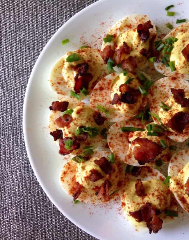 Bacon deviled eggs on a white plate