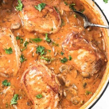 Close up overhead image of pork chops smothered in gravy