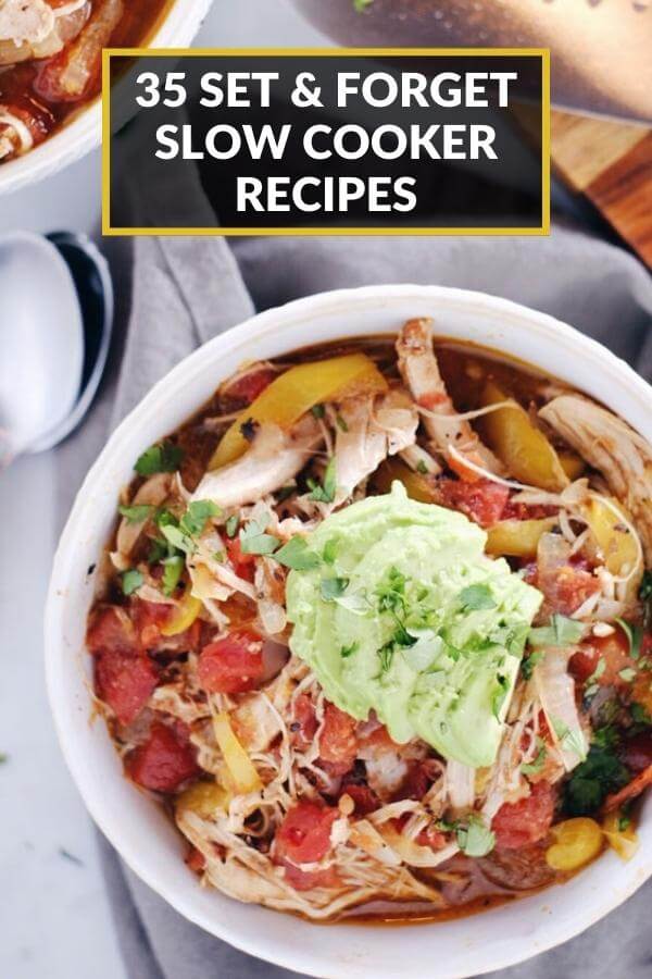 Overhead image of slow cooker chicken enchilada soup in a bowl with text overlay at top