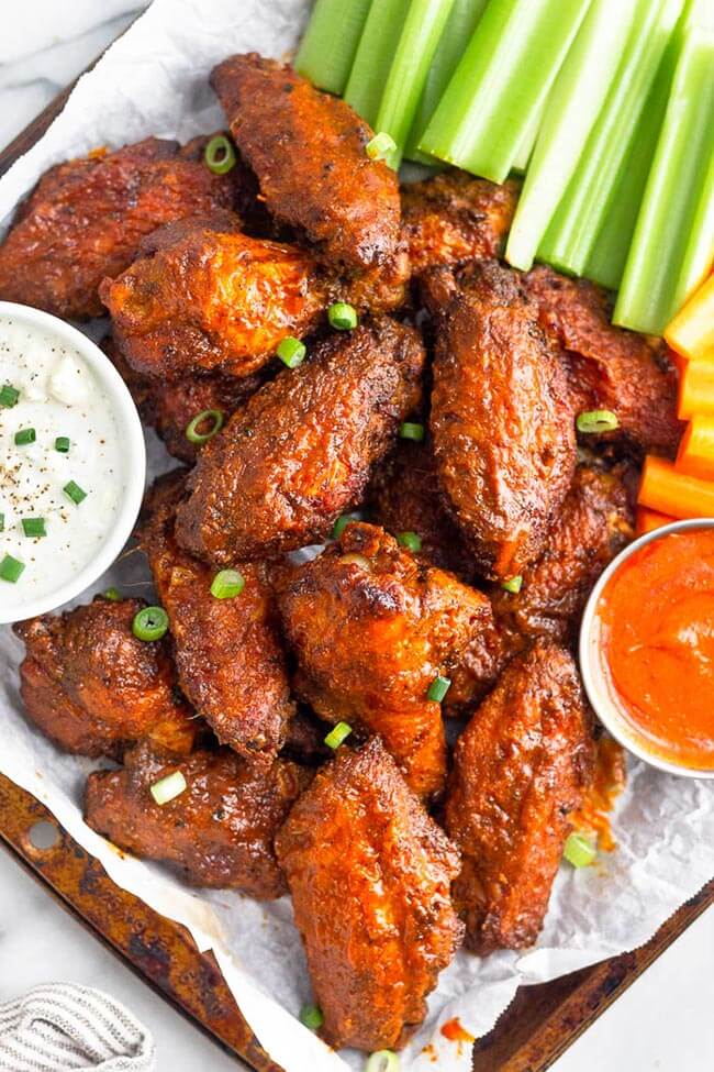 Air fryer buffalo wing with ranch, carrots, celery and buffalo dipping sauce