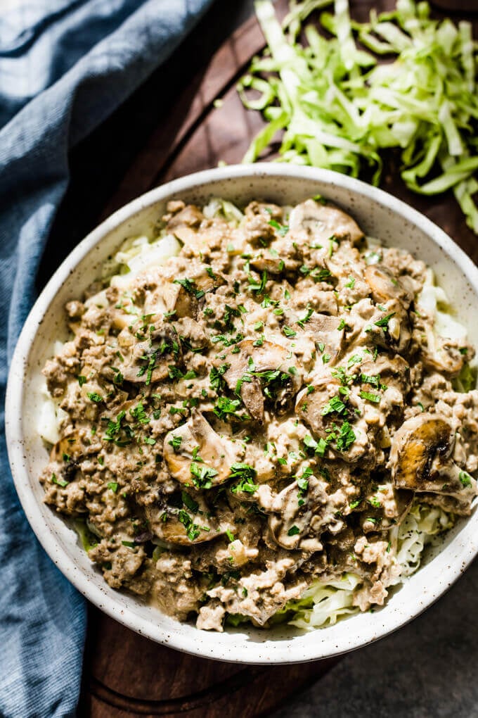 Ground beef stroganoff in a bowl with mushrooms and parsley