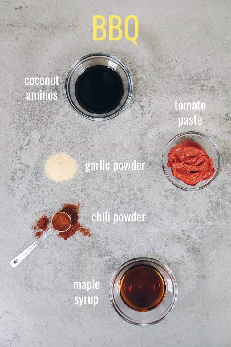 BBQ marinade ingredients laid out on gray background with text overlay by ingredients