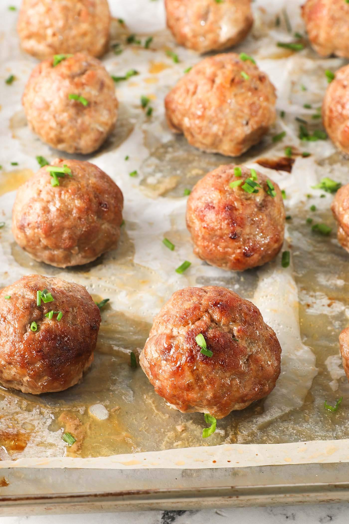 Close up image of baked ground pork meatballs
