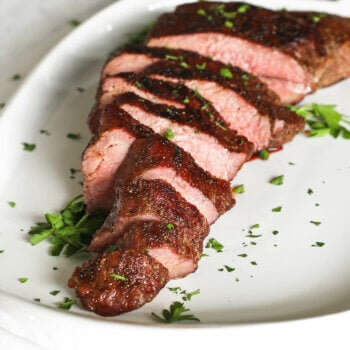 Close up angle image of smoked tri-tip on a platter