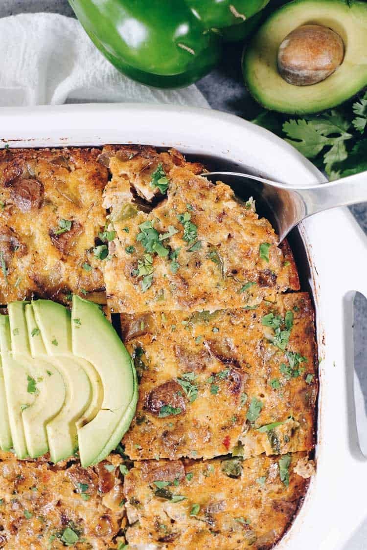 This Paleo and Whole30 Breakfast Burrito Casserole has all of the flavors of a breakfast burrito you love - just minus the tortilla. Eggs, sausage, potatoes, onion, salsa, avocado and cilantro make this a perfect casserole. Paleo + Whole30. | realsimplegood.com