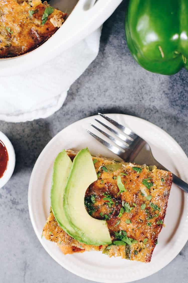 This Paleo and Whole30 Breakfast Burrito Casserole has all of the flavors of a breakfast burrito you love - just minus the tortilla. Eggs, sausage, potatoes, onion, salsa, avocado and cilantro make this a perfect casserole. Paleo + Whole30. | realsimplegood.com