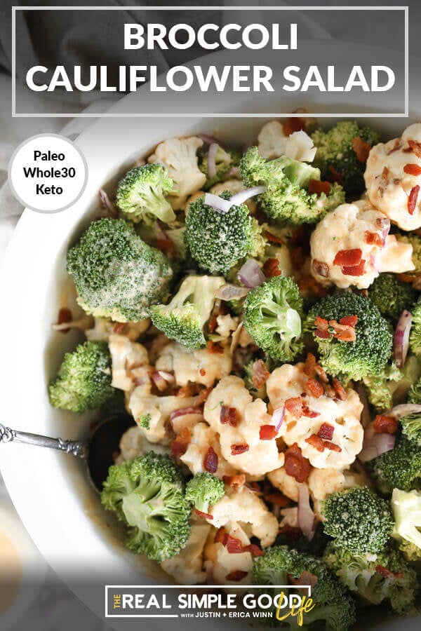 Broccoli and cauliflower florets with bacon and red onion sprinkled on top close up overhead image. Text at top of "broccoli cauliflower salad".