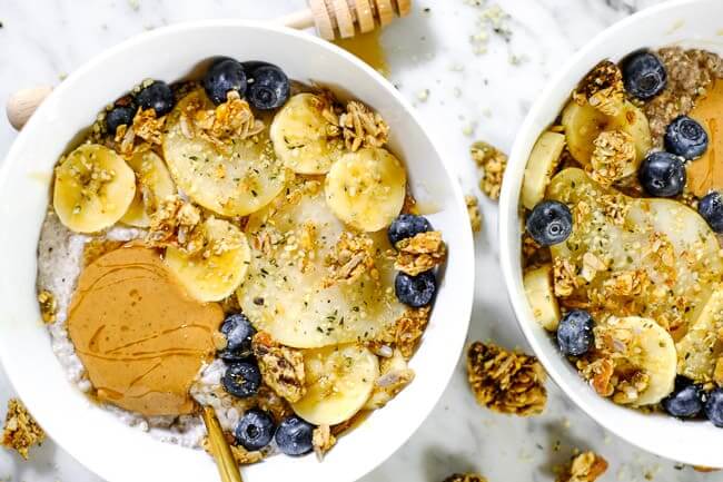 Chai spiced paleo chia seed pudding with sliced bananas, pears, blueberries, grain free granola and nut butter. 