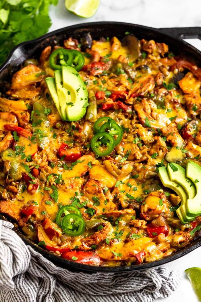 Overhead shot of chicken fajita casserole in a cast iron skillet