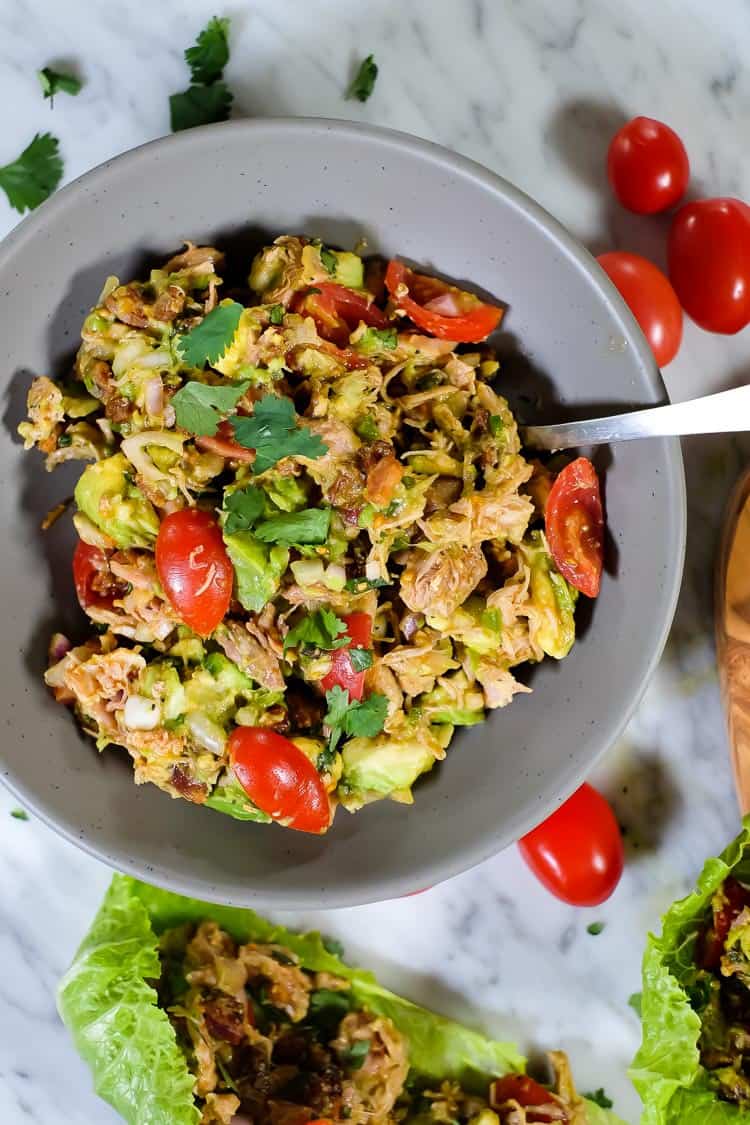 This Paleo and Whole30 chicken avocado salad with bacon is creamy, flavorful and satisfying! You can make it ahead of time or whip it up in 20 minutes. You will love the ease and fuss-free nature of the tasty Paleo and Whole30 friendly ingredients and just how fast it all comes together!  | realsimplegood.com #paleo #whole30 #quickmeal #easymeal