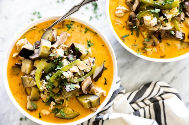 Chicken coconut curry soup two bowls overhead horizontal image